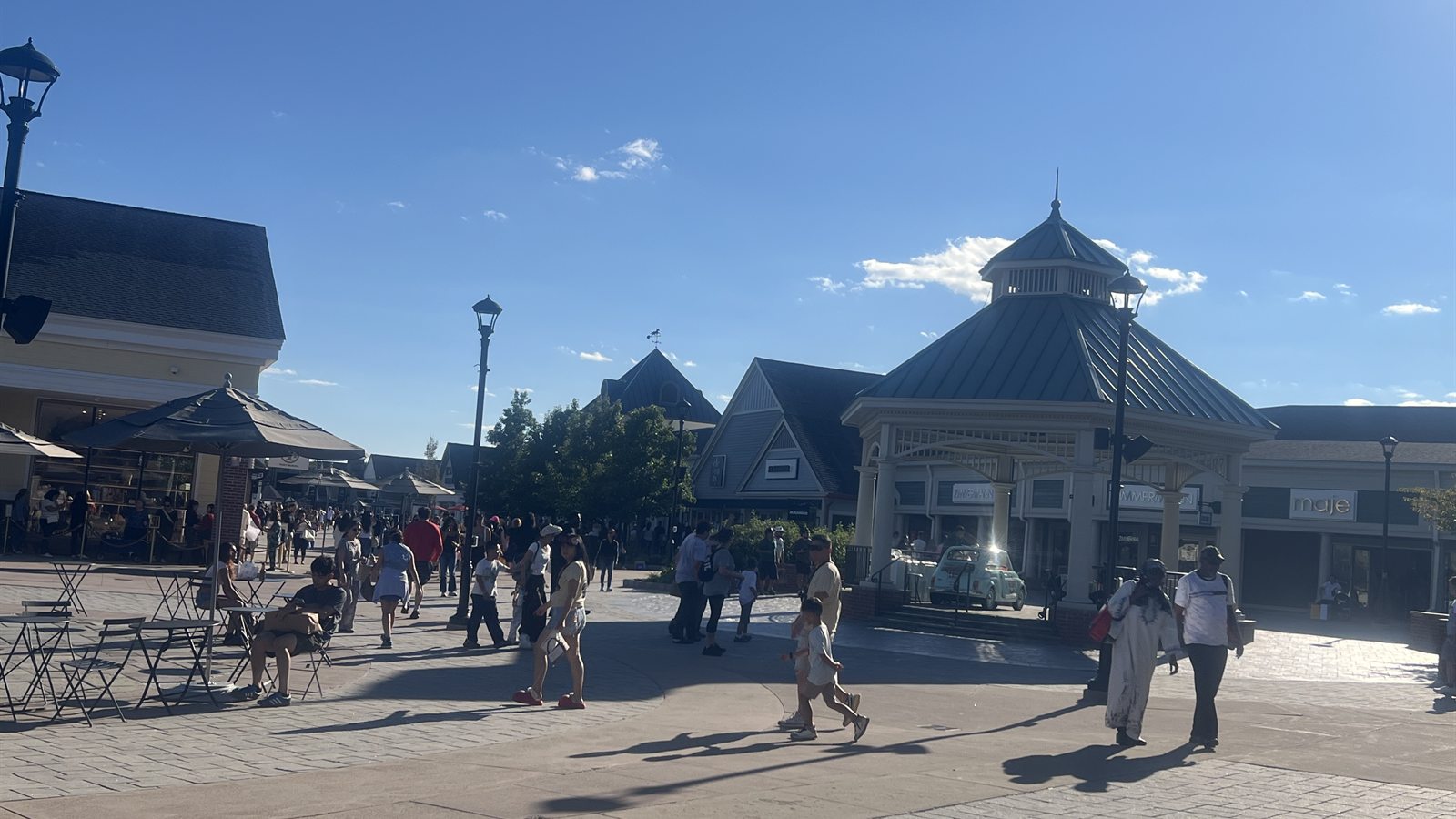 Plaza and pavilion at Woodbury Common with the Zimmermann and maje storefronts behind